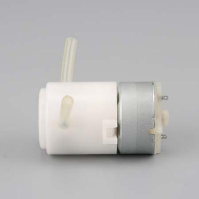 Micro dosing pump for kitchen or laundry equipment